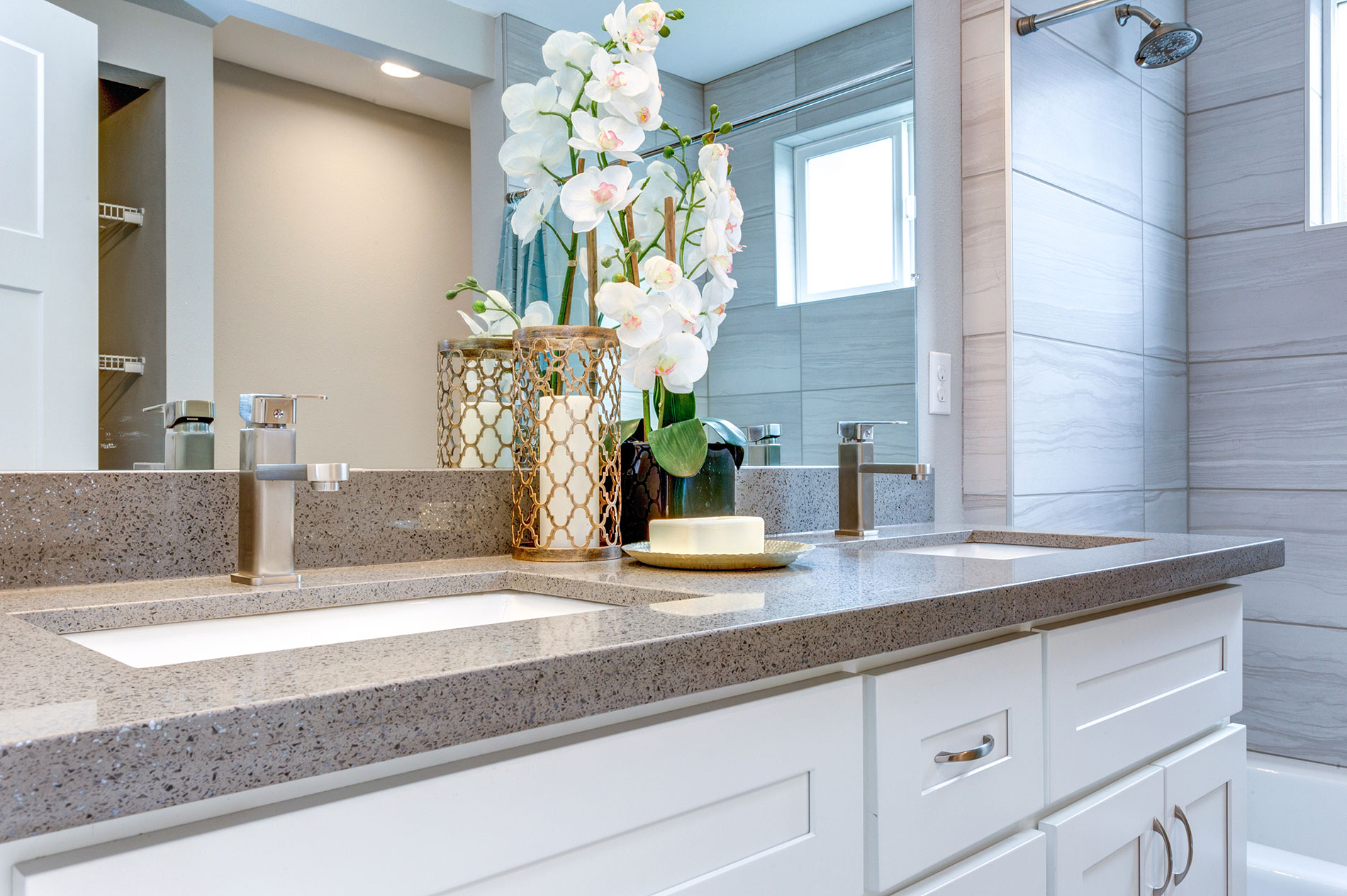 Bathroom With Navy Vanity And Vetrazzo Countertop